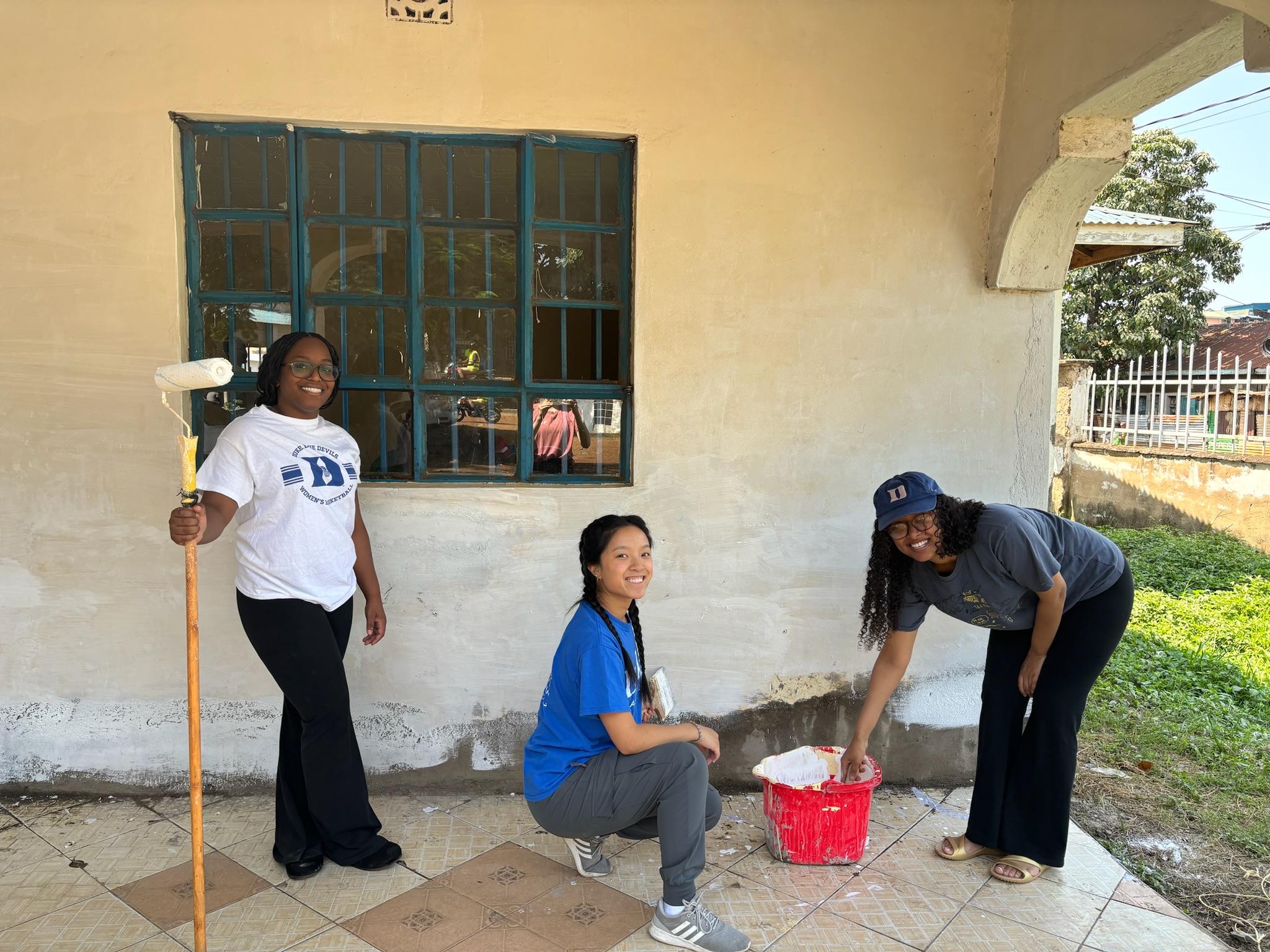 Volunteers painting exterior walls